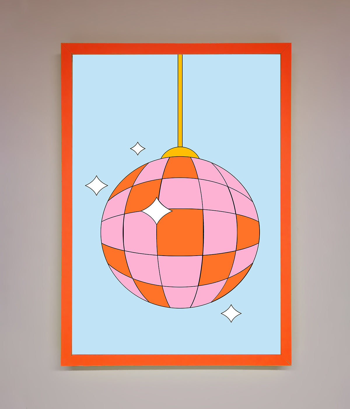 Pink and orange disco ball framed poster hanging on a wall.