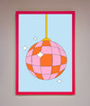 Pink framed poster featuring a colorful disco ball design.