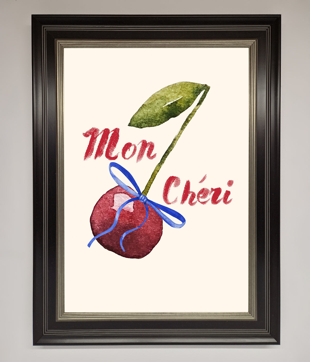 Mon Cheri Cherry Framed Wall Art featuring a cherry with a ribbon, adding elegance and color to decor.