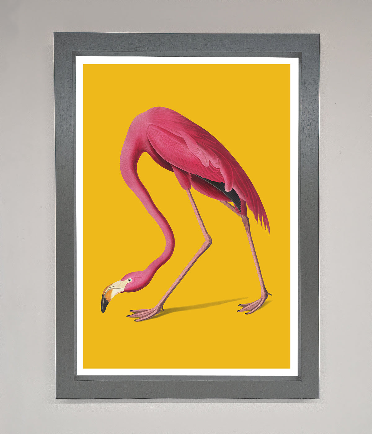 Pink Flamingo on Yellow Framed Print, vibrant wall art.