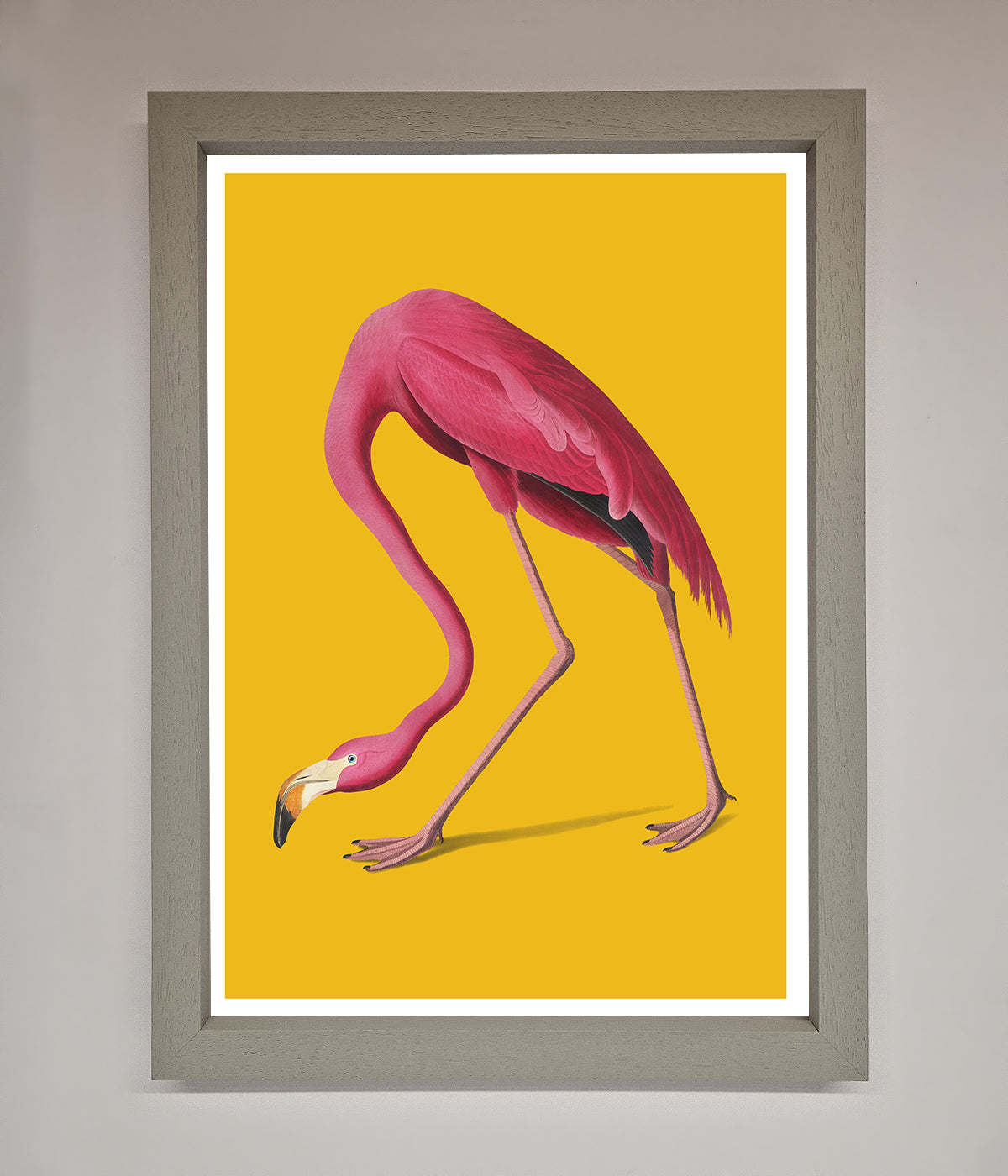 Pink Flamingo On Yellow Framed Print with vibrant colors and elegant design.