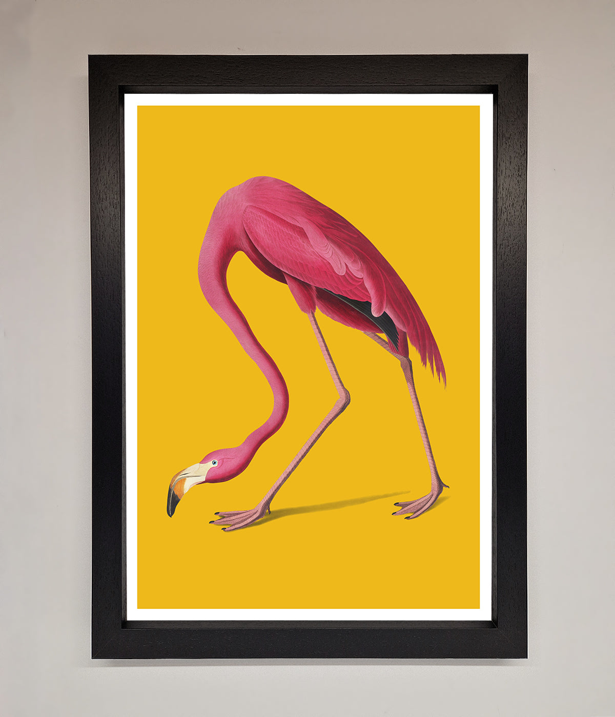 Pink Flamingo On Yellow Framed Print, vibrant wall art.