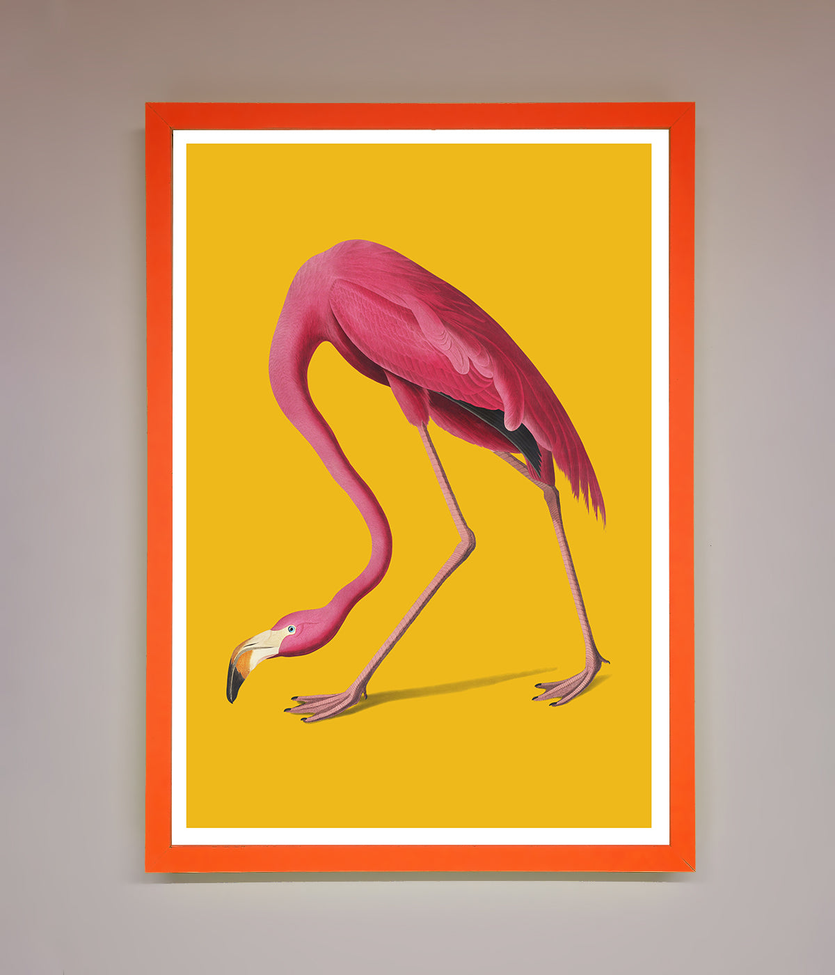 Pink flamingo on yellow framed print for vibrant home decor.