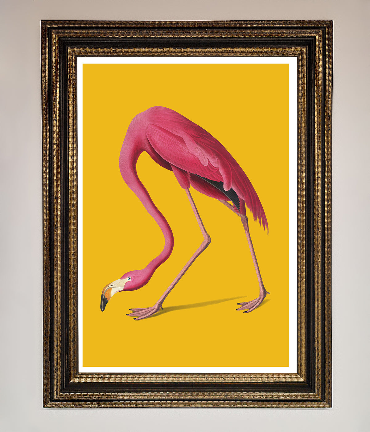 Pink Flamingo on Yellow Framed Print, vibrant wall art for home or office decor.