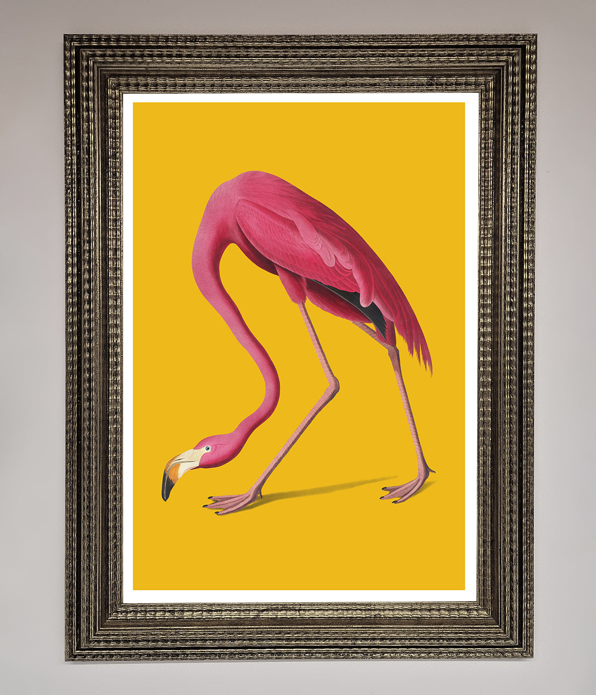 Pink Flamingo on Yellow Framed Print, vibrant wall art for home or office.