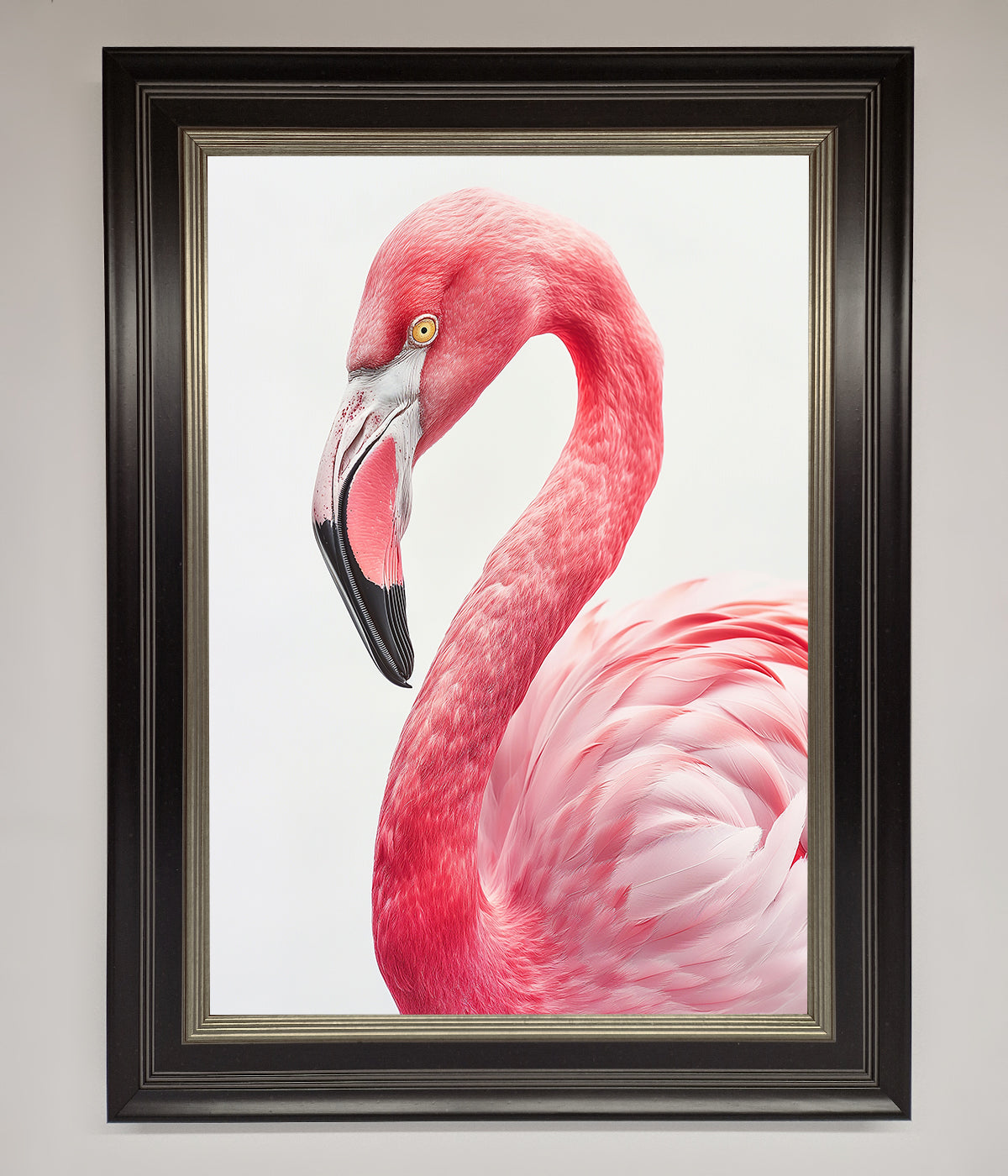 Framed print of a pink flamingo staring, adding elegance and color to any decor.