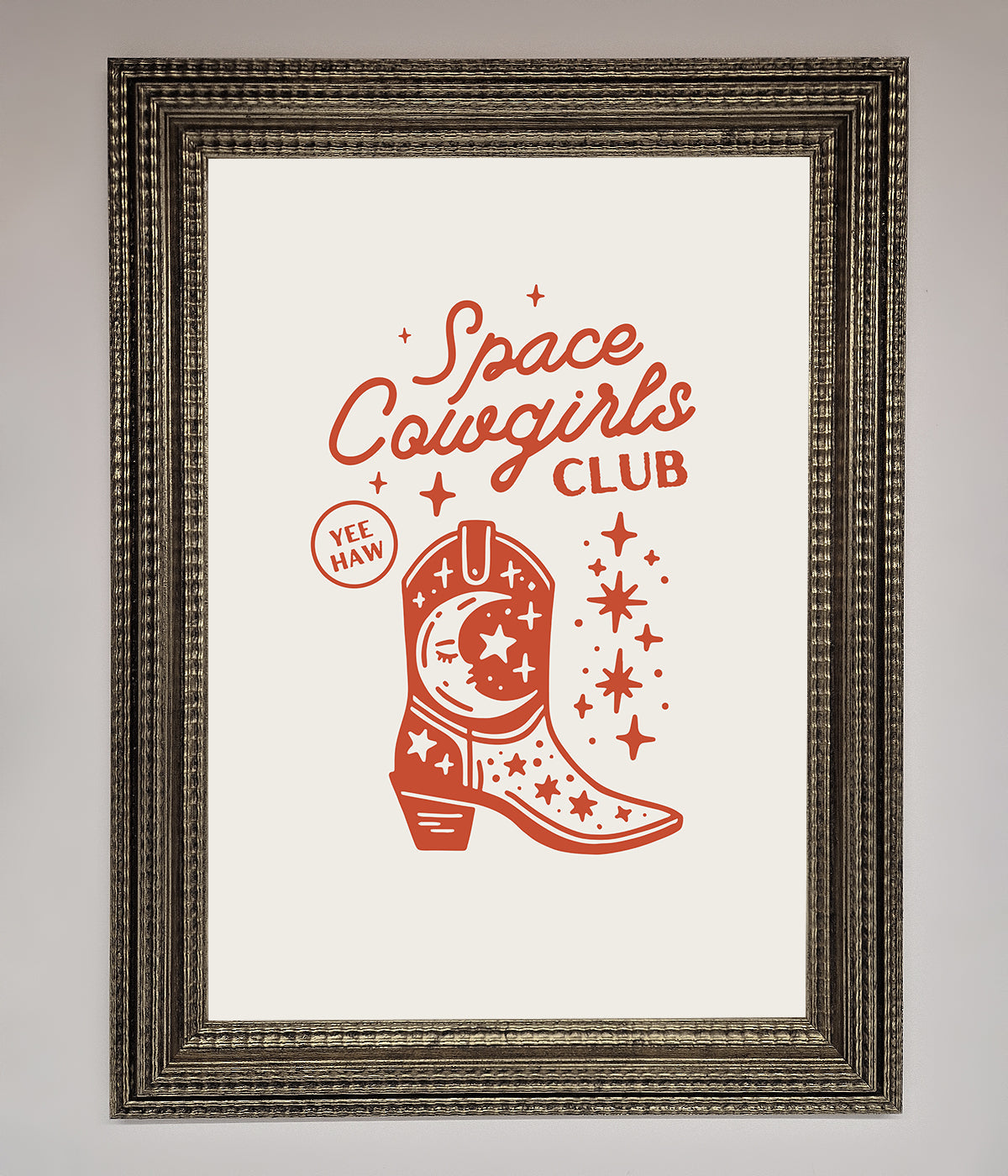 Framed wall art with "Space Cowgirls Club" design featuring cosmic elements and a rustic boot.