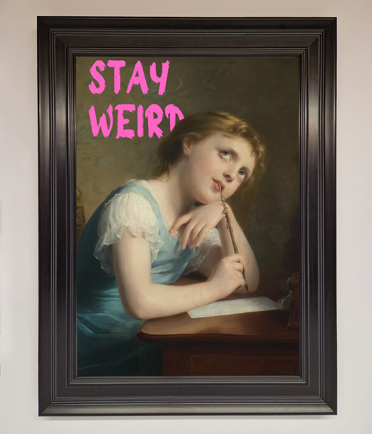 Stay Weird Framed Print with vintage-style art and text.