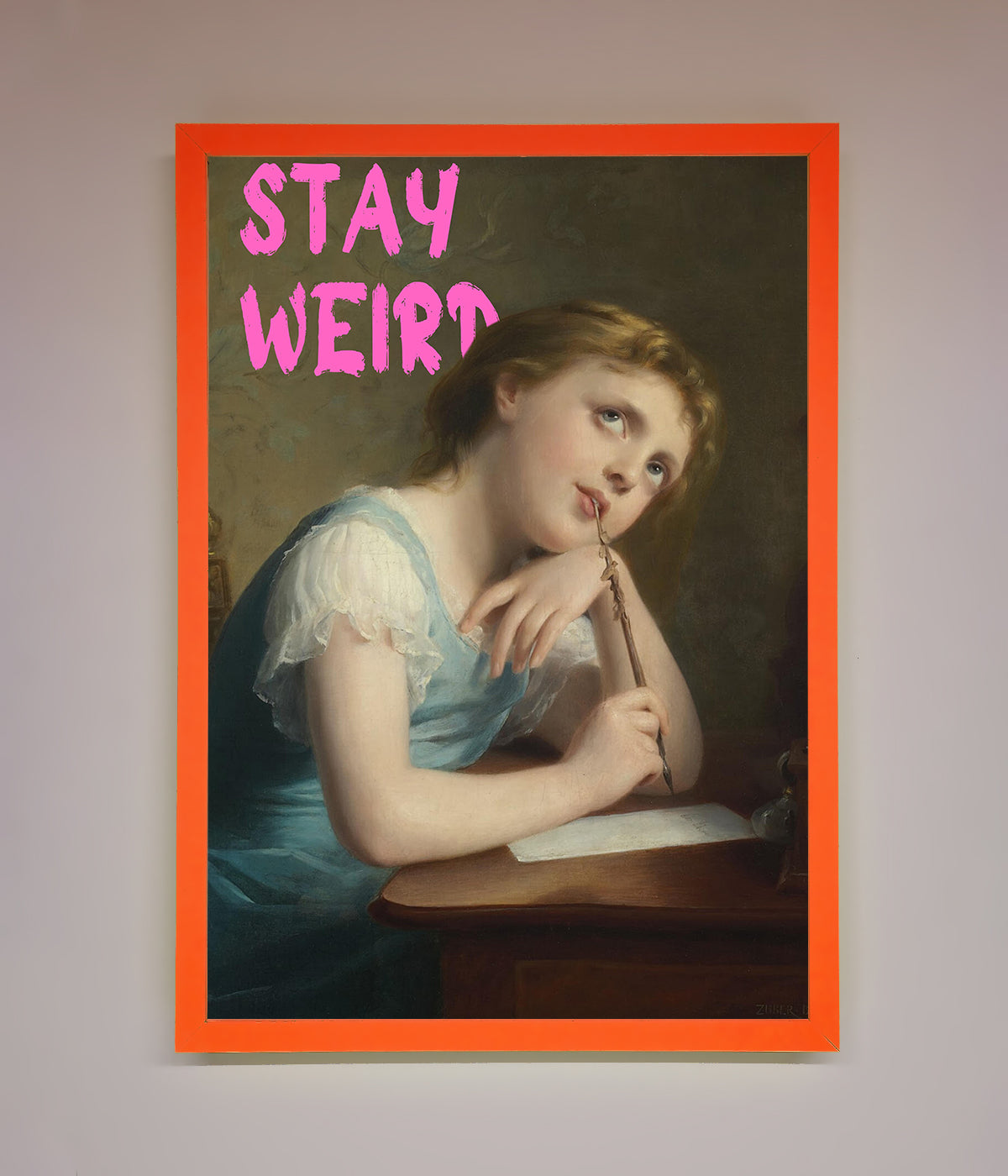 Stay Weird framed print with vintage art and orange border.