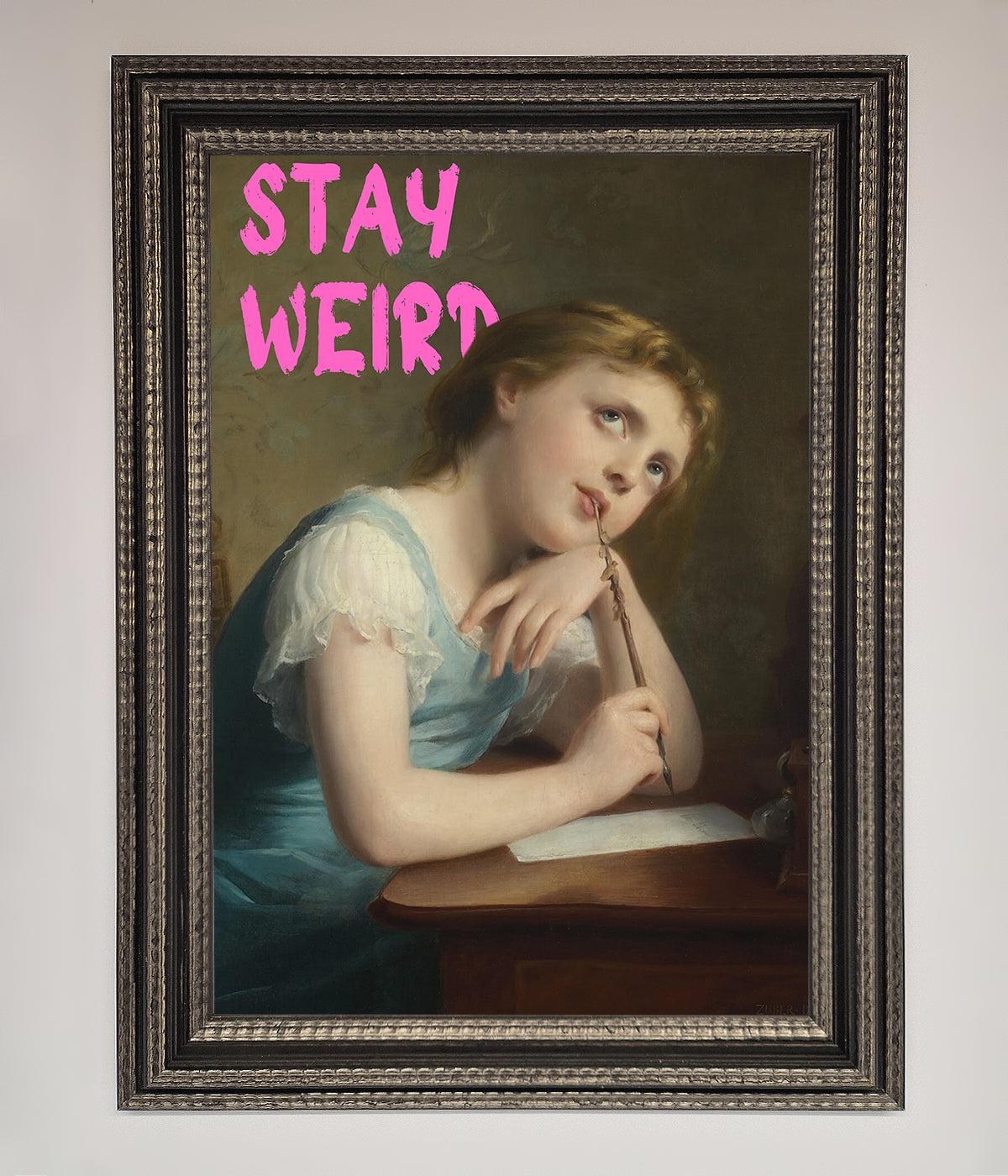 Framed print of a woman in a classic painting with the text "Stay Weird."