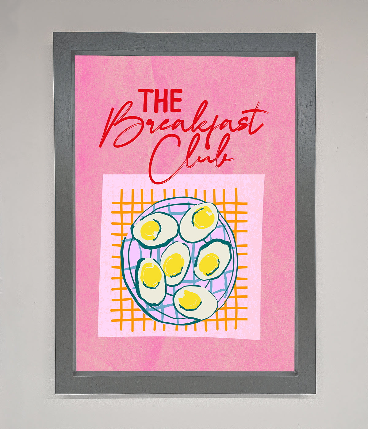 The Breakfast Club framed wall art with retro design on a pink background.