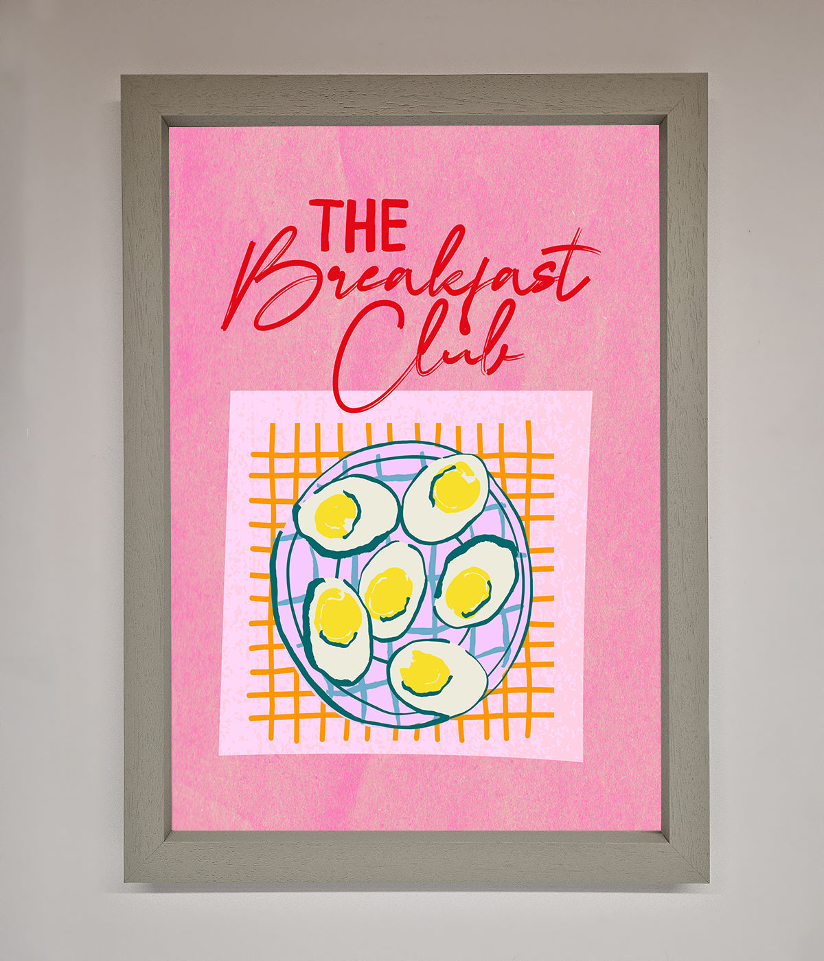 The Breakfast Club Framed Wall Art with eggs and vibrant colors on a pink background.