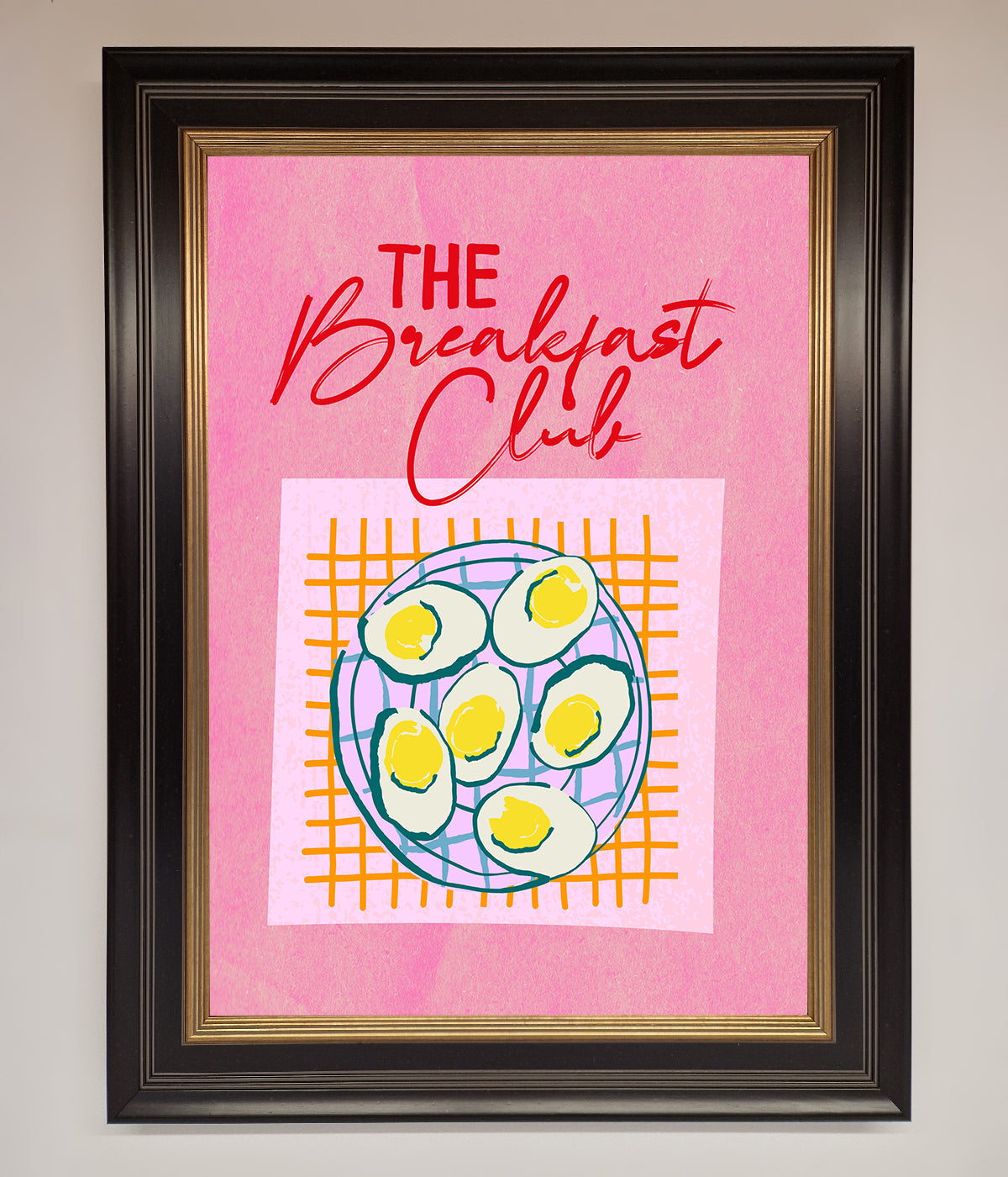 The Breakfast Club Framed Wall Art with retro design on pink background.