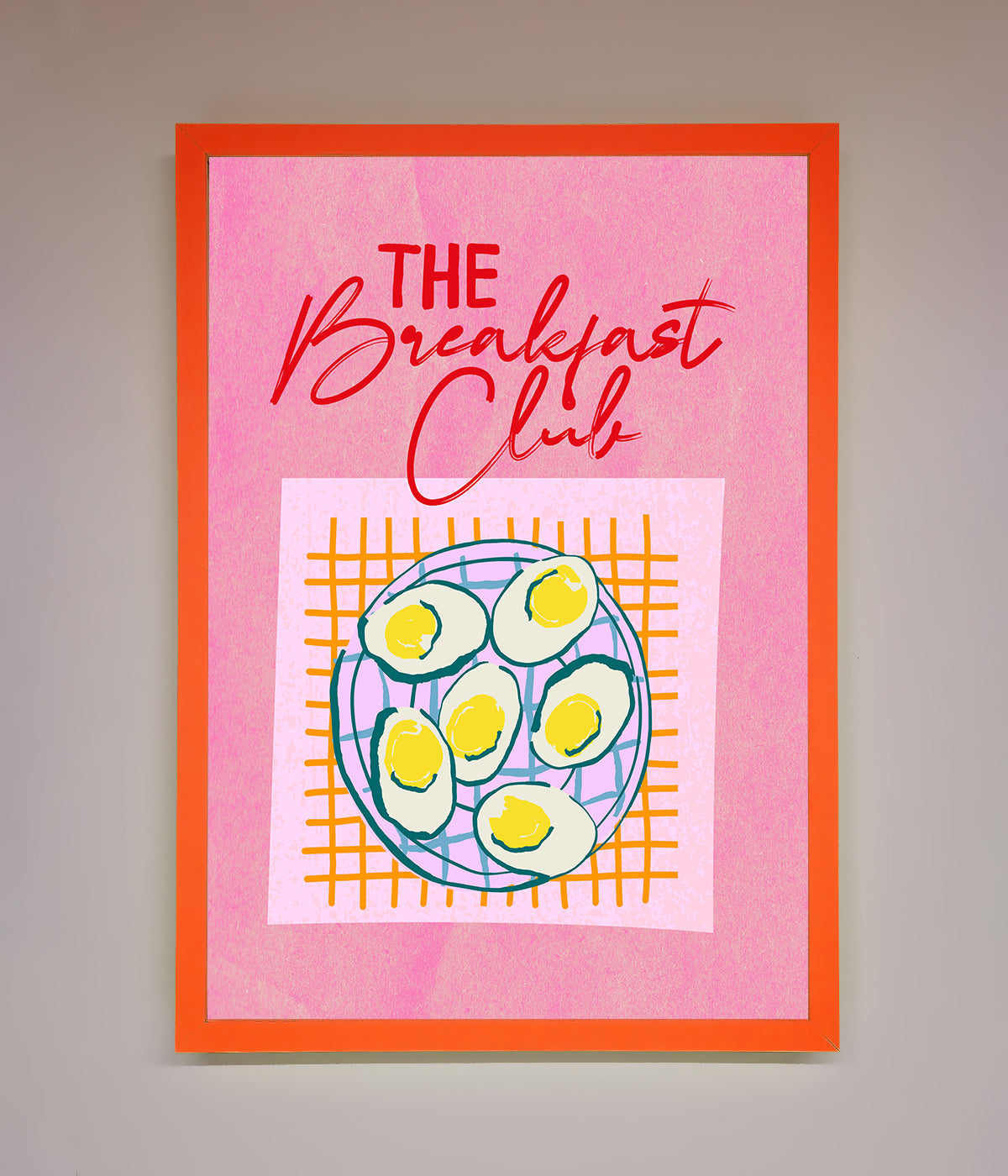 The Breakfast Club framed wall art with retro design on pink background.