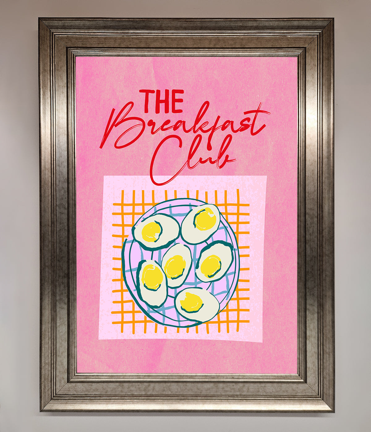 The Breakfast Club framed wall art with retro design on pink background.