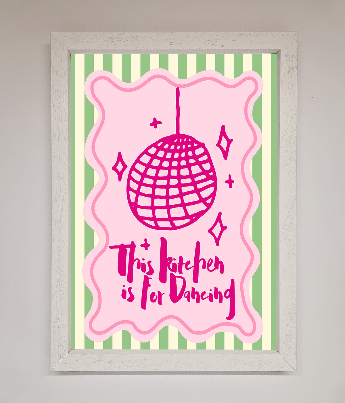 Framed wall art with a pink disco ball illustration and "This Kitchen Is For Dancing" text.