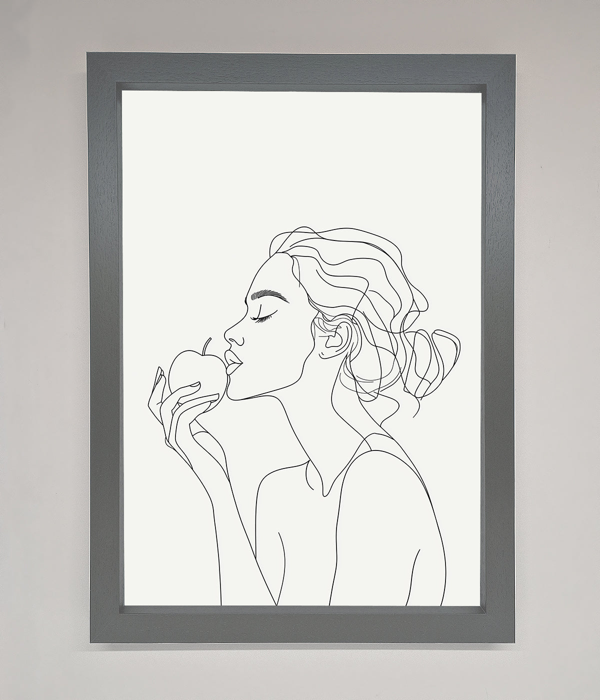 Line drawing of a woman holding an apple in a framed poster.